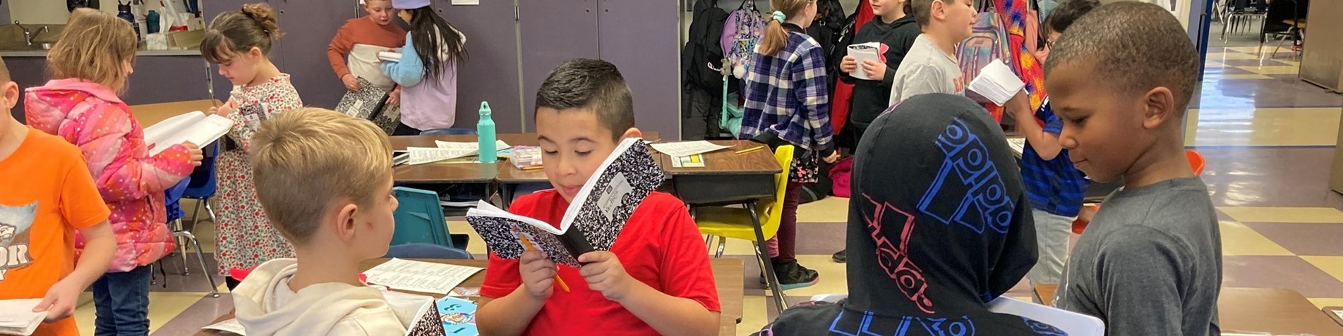 Pomona Elementary students reading to each other 