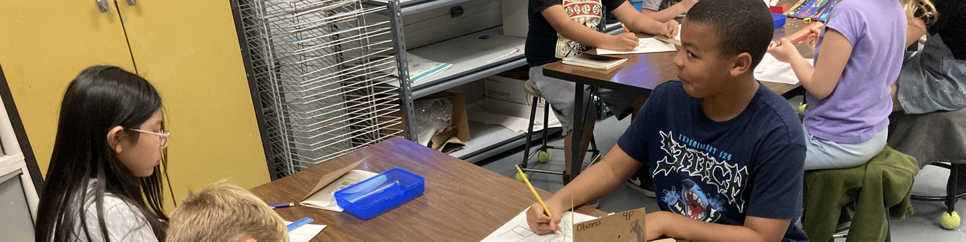 Pomona Kids working and smiling 