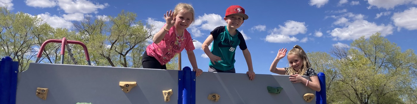 Little kids on climbing wall